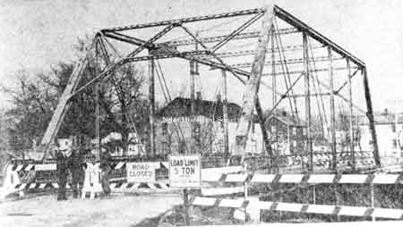A 1950 newspaper photograph of the antiquated steel Federal St. Bridge across Mosquito Creek which has been replaced by a new concrete span. The old-timer had a five ton limit and a foot walk on the north side...It's last picture is just before the start of the bridge last spring.