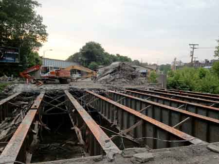 Demolition in 2013 of the 1953 bridge that carries Robbins Avenue traffic across the Mosquito Creek.