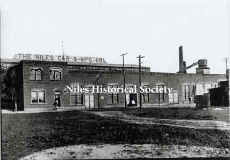 Erie Street view of the Niles Car & Manufacturing Co., makers of one of the finest lines of plush electric cars of the area