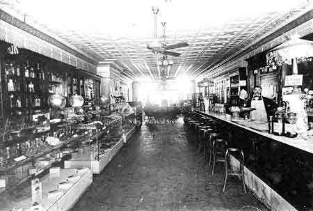 In 1900 Caramella's Confectionary & Ice Cream Parlor opened next to the Grand Saloon. This interior shot was taken in 1906 after the store had been recently remodeled.