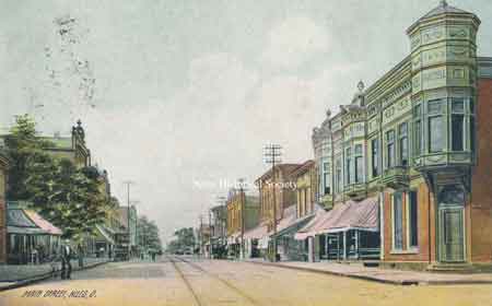 View of South Main Street looking north from MillStreet(State Street). The corner building on the right is the Hartzell Building.