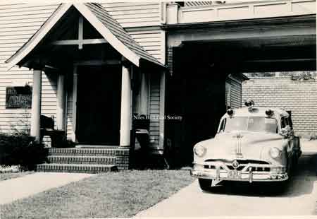 1951 ambulance in front of Holeton Funeral Home which now had a covered entrance.