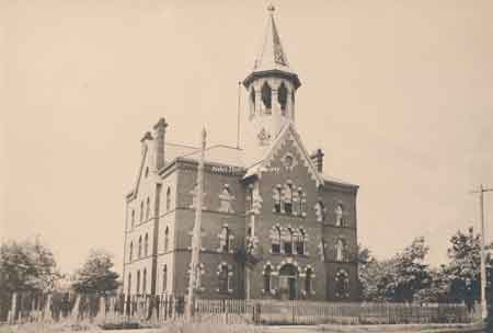 Front view of Central School showing front entrance, brickwork and steeple.