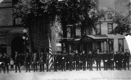 The Knights of Pythias members in front of the Wagstaff building, which stood north of the Swaney building on North Main Street, on the west side of the street. (Where the McKinley Memorial stands now).
