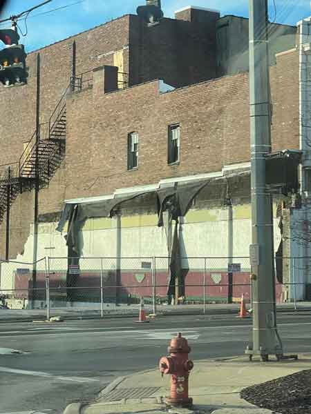 View of the Robins Theatre Building after the razing of Reisman's Store at the corner of South Main and West State Streets.