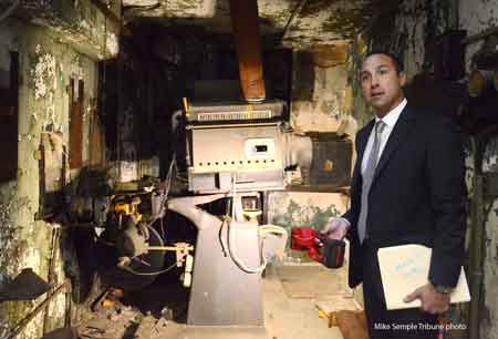 Walking through the vacant building on South Main Street downtown, Mayor Steve Mientkiewicz, flashlight in hand, carefully navigated through the remnants of what once were offices.