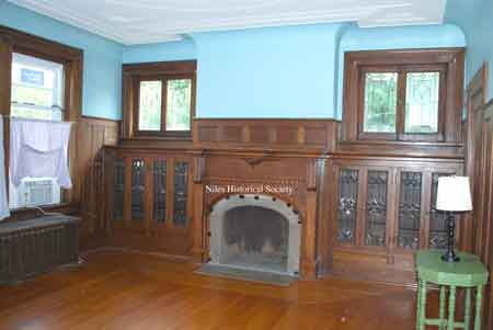 Pictured above is the formal dining room with marble fireplace mantel.