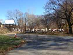 The site is now only trees and the pavement remnants of the old Church Street entrance to Robbins Avenue