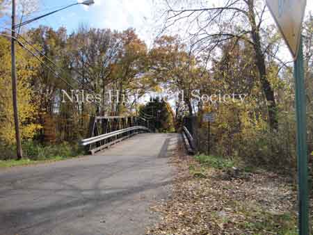 The Iron Bridge with its wooden roadway provided access to Salt-Spring Road from the end of Fifth Avenue. This bridge was often referred to as a 'Humpback Bridge' due to the upward arch of the roadway. This bridge was damaged in 2011 and replaced with a modern steel structure.