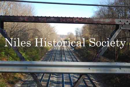 The Iron Bridge with its wooden roadway provided access to Salt-Spring Road from the end of Fifth Avenue. This bridge was often referred to as a 'Humpback Bridge' due to the upward arch of the roadway. This bridge was damaged in 2011 and replaced with a modern steel structure.
