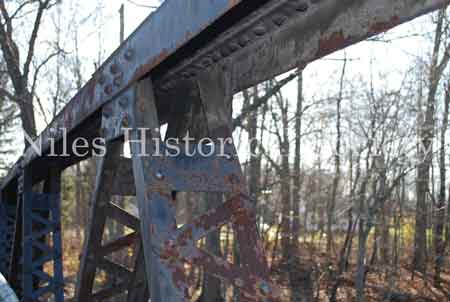 The Iron Bridge with its wooden roadway provided access to Salt-Spring Road from the end of Fifth Avenue. This bridge was often referred to as a 'Humpback Bridge' due to the upward arch of the roadway. This bridge was damaged in 2011 and replaced with a modern steel structure.