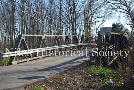 The Iron Bridge with its wooden roadway provided access to Salt-Spring Road from the end of Fifth Avenue. This bridge was often referred to as a 'Humpback Bridge' due to the upward arch of the roadway. This bridge was damaged in 2011 and replaced with a modern steel structure.