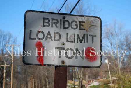 The Iron Bridge with its wooden roadway provided access to Salt-Spring Road from the end of Fifth Avenue. This bridge was often referred to as a 'Humpback Bridge' due to the upward arch of the roadway. This bridge was damaged in 2011 and replaced with a modern steel structure.