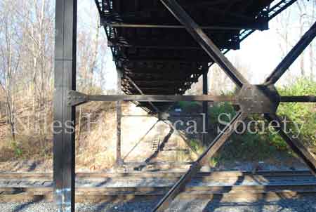 The Iron Bridge with its wooden roadway provided access to Salt-Spring Road from the end of Fifth Avenue. This bridge was often referred to as a 'Humpback Bridge' due to the upward arch of the roadway. This bridge was damaged in 2011 and replaced with a modern steel structure.