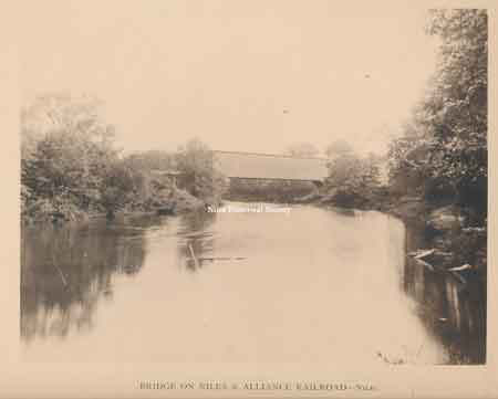 Niles-Alliance railroad covered bridge over the Mahoning River. It was built in the late 1880's. Later the bridge became part of the Pennsylvania Railroad.