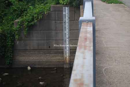 View of bridge showing water level scale.