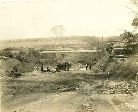 July 22, 1921, working on the Niles-McDonald Viaduct. Workers are preparing to undercut the railroad tracks to build the trestle.