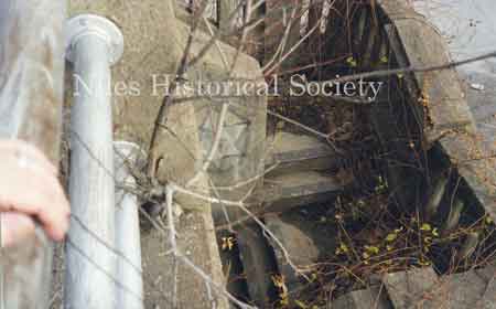 The deterioration of the bridge stairway structure that made the renovation essential.