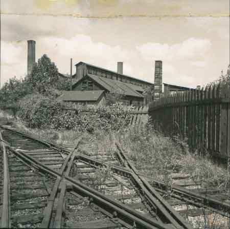 Weed-covered and rusted railroad tracks still point their rails at the frame buildings of “old No. 1.”