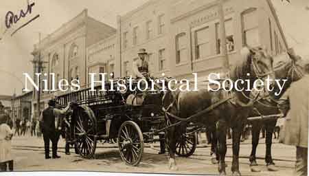 View of a horsedrawn fire engine standing on the corner of East Park Avenue and Furnace Street(which later became State Street).