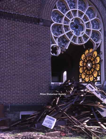 Exterior view of the stained glass window during the demolition of the church in 1966.