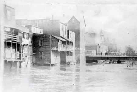 Park Avenue Bridge over Mosquito Creek and rear of buildings on East State Sreet.