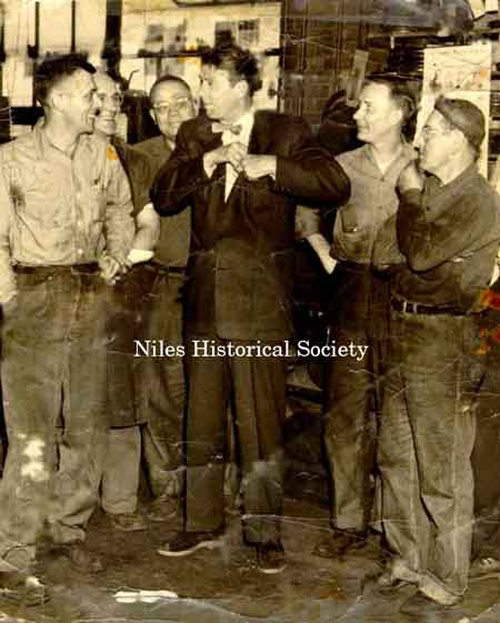 Ronald Reagan with unidentified workers. 