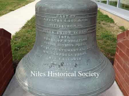 The bell, first cast in 1871, now hangs on the grounds of the new (2013) Niles McKinley High School at 616 Dragon Drive.