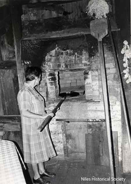 Margaret Marsico with pizza oven