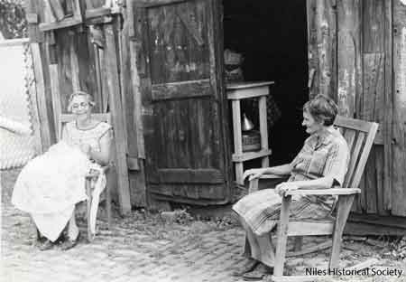Kathryn and Margaret Marsico sat near the door of the old oven for the last time before the oven was demolished.