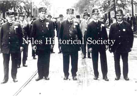 Niles Police leading a parade. L to R: