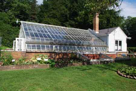 Mrs. Thomas grew most of the flowers herself in the greenhouse which was located just a few yards from the main house.