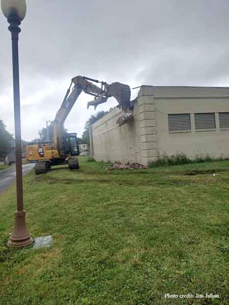 A series of photographs of the Waddell Pool bath house as it is demolished on September 6, 2022.