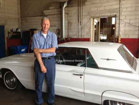 Bill Haydu with his white Thunderbird.