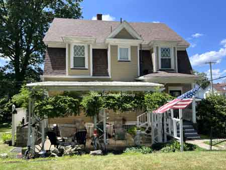 Rear view of house with pergola.