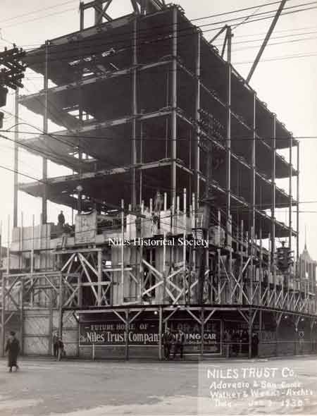 A series of photographs documenting the various stages of the construction of the Niles Trust Company Building.