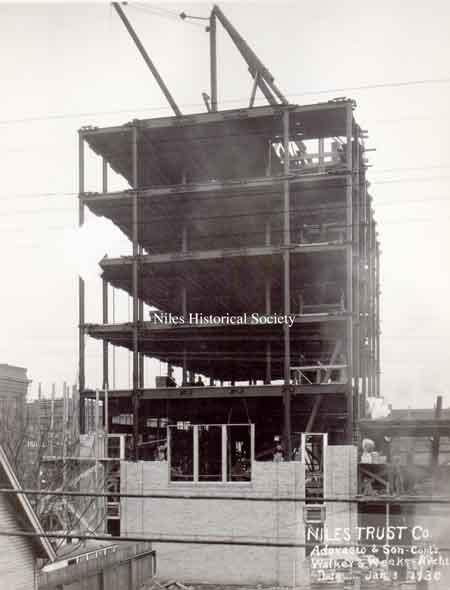 A series of photographs documenting the various stages of the construction of the Niles Trust Company Building.