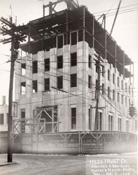 A series of photographs documenting the various stages of the construction of the Niles Trust Company Building.