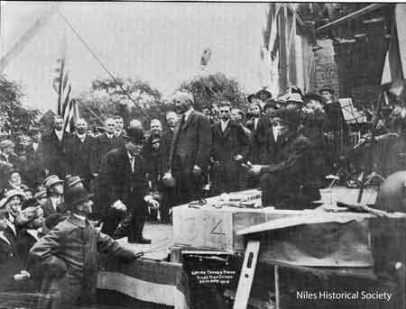 Daniel Sullivan, on cornerstone[1862-1939] at laying of cornerstone for Niles High School [1914].