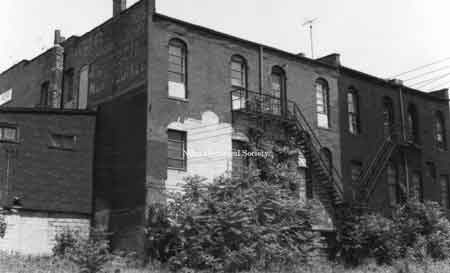 Rear facades of Western Auto building and neighboring buildings. These were located on East State Street.