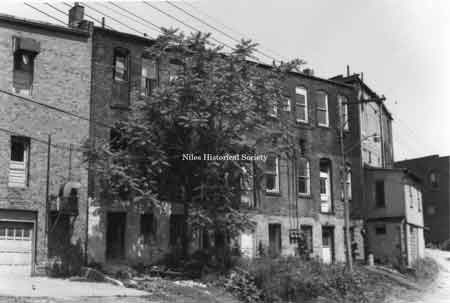 Rear facades of several old buildings in downtown Niles prior to urban renewal.