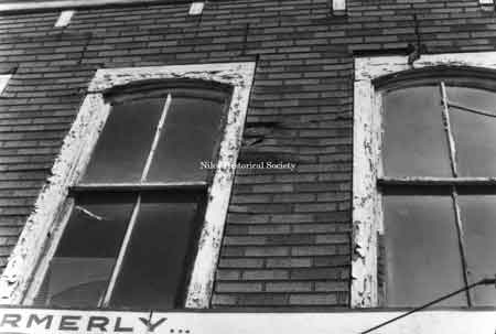 Photo taken showing marked deterioration on windows on building located in downtown Niles before urban renewal.
