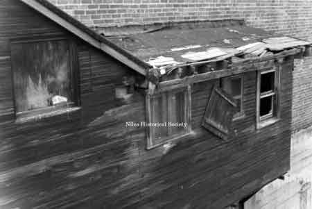 Picture of detail of rear facade of building located in Niles, overhanging Mosquito Creek.