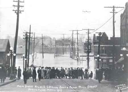 Main Street looking south from Mill Street (State Street) during flood, March 1913.