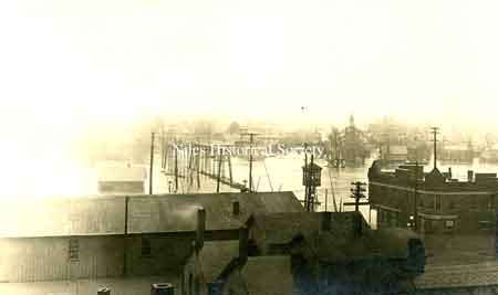 A postcard photo of the 1913 flood as seen from the rooftops of Main Street looking south from town.